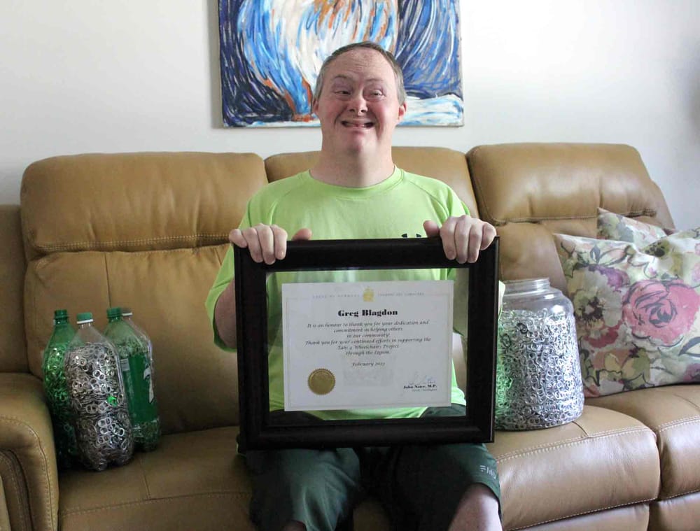 Greg Blagdon with his certificate from the House of Commons