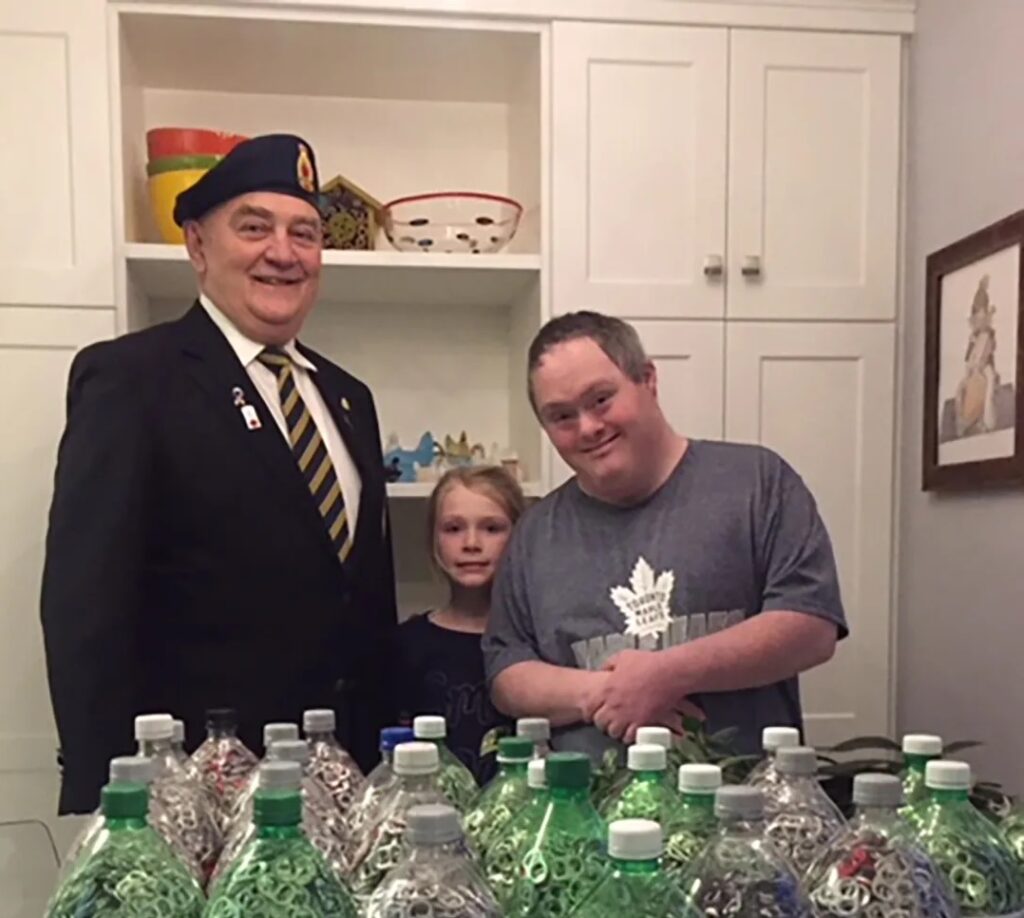 Greg Blagdon with donated pop tabs